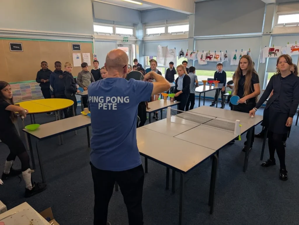 PingPong4U coaching primary school pupils during table tennis session at Plover School in Leeds